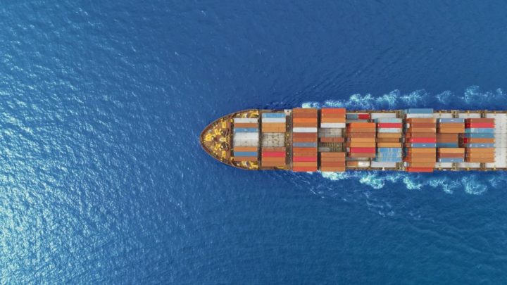 aerial photo of a cargo ship in deep blue water